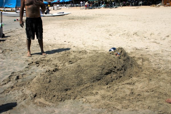 Some friends they were, buried him up to his sunglasses